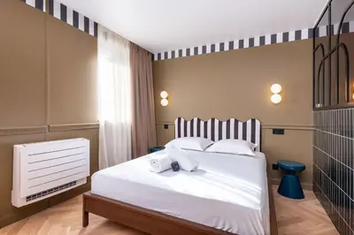Un ou plusieurs lits dans un hébergement de l'établissement Studio Art Déco Escapade Élégante et Raffinée