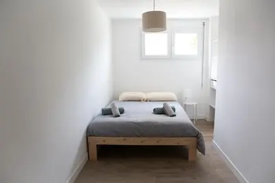 Un ou plusieurs lits dans un hébergement de l'établissement Charmant appartement T3