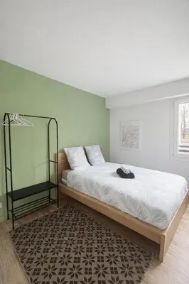 Un ou plusieurs lits dans un hébergement de l'établissement Escapade Lyonnaise - Studio proche Gare & Doua