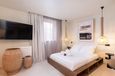 Un ou plusieurs lits dans un hébergement de l'établissement Appartement de charme-Luxe, douceur et harmonie