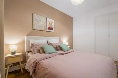 Un ou plusieurs lits dans un hébergement de l'établissement Le Verdoyant Netflix Grand balcon Padel
