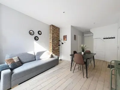 Coin salon dans l'établissement Appartement confortable Oullins centre