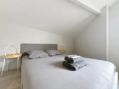 Un ou plusieurs lits dans un hébergement de l'établissement Appartement confortable Oullins centre