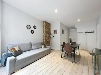 Coin salon dans l'établissement Appartement confortable Oullins centre