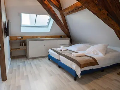 Un ou plusieurs lits dans un hébergement de l'établissement Appartements du Château GrandClément, entre Histoire & Modernité Cœur Métropole