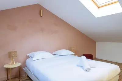 Un ou plusieurs lits dans un hébergement de l'établissement Maison d'exception au coeur de Lyon avec piscine
