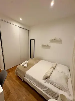 Un ou plusieurs lits dans un hébergement de l'établissement Le Cosy Grange Blanche - 2 chambres