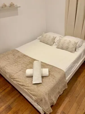 Un ou plusieurs lits dans un hébergement de l'établissement Le Cosy Grange Blanche - 2 chambres