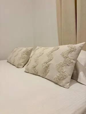 Un ou plusieurs lits dans un hébergement de l'établissement Le Cosy Grange Blanche - 2 chambres
