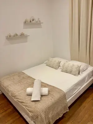 Un ou plusieurs lits dans un hébergement de l'établissement Le Cosy Grange Blanche - 2 chambres