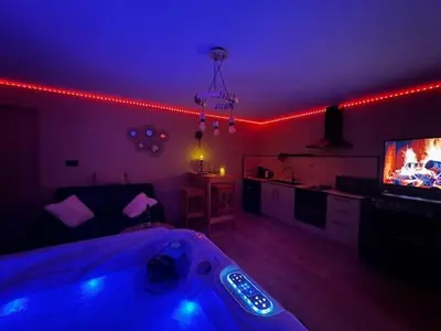 Télévision ou salle de divertissement dans l'établissement les suites privilèges