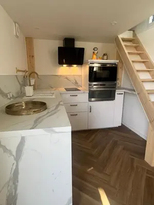 Cuisine ou kitchenette dans l'établissement La Tiny du Rioux