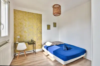 Un ou plusieurs lits dans un hébergement de l'établissement Appartement de charme, proche de toutes commonidités