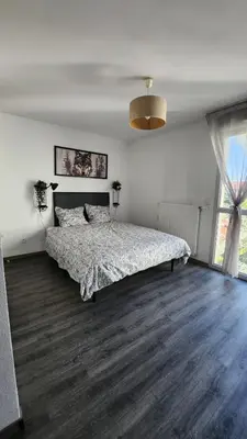 Un ou plusieurs lits dans un hébergement de l'établissement Cosy Studio Monplaisir Lumière Metro Lyon 8