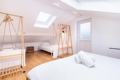 Un ou plusieurs lits dans un hébergement de l'établissement L'appart Breztel & SPA Medipole