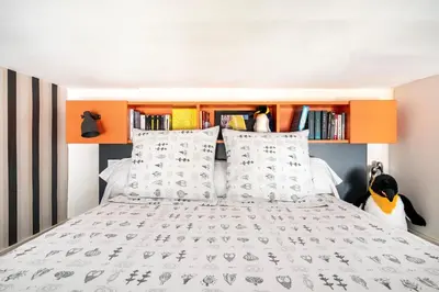Un ou plusieurs lits dans un hébergement de l'établissement Studio Design Part-Dieu Tête d'Or
