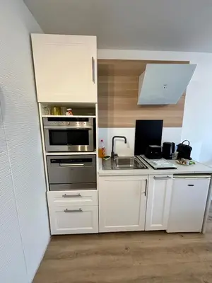 Cuisine ou kitchenette dans l'établissement Studio Cosy et élégant avec Terrasse