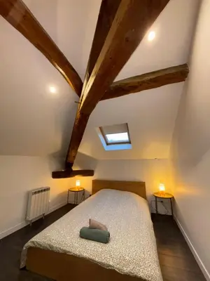 Un ou plusieurs lits dans un hébergement de l'établissement Appartement La Forêt Villebois 01