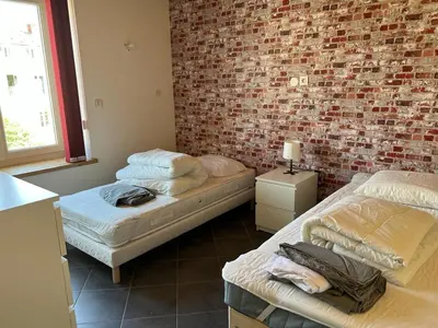 Un ou plusieurs lits dans un hébergement de l'établissement Duplex spacieux au centre du village 205