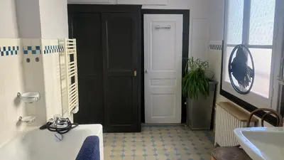 Télévision ou salle de divertissement dans l'établissement Studio FRANKLIN