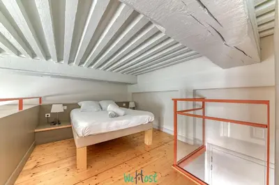 Un ou plusieurs lits dans un hébergement de l'établissement Escapade cosy au cœur de Lyon