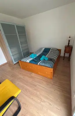 Un ou plusieurs lits dans un hébergement de l'établissement Un appartement dans un coin tranquille
