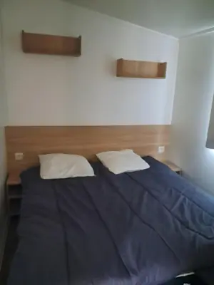 Un ou plusieurs lits dans un hébergement de l'établissement Camping du moulin