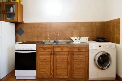 Cuisine ou kitchenette dans l'établissement Lyon 7 60m 4 pers Ascenseur Proche transports