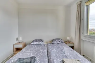 Un ou plusieurs lits dans un hébergement de l'établissement Le Grand Refuge - Terrasse Privée - Jonage
