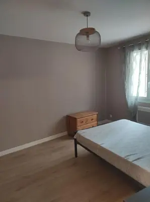 Un ou plusieurs lits dans un hébergement de l'établissement Saint Denis en bugey proche de la CNPE Appartement rénové en rez de chaussée