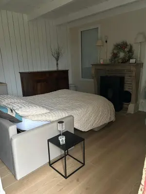 Un ou plusieurs lits dans un hébergement de l'établissement Le Cottage