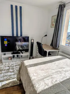 Télévision ou salle de divertissement dans l'établissement Chambre
