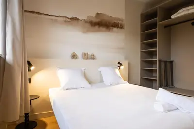 Un ou plusieurs lits dans un hébergement de l'établissement Le Confluence - Cocooning City Lyon