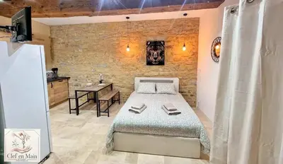 Un ou plusieurs lits dans un hébergement de l'établissement Le Petit Cocon Cozy studio proche de Lyon