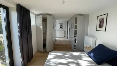 Un ou plusieurs lits dans un hébergement de l'établissement Studio design lumineux avec jardin privatif, Proche Lyon, Eurexpo, Aéroport, Groupama Stadium