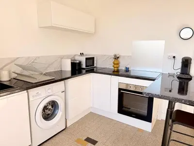 Cuisine ou kitchenette dans l'établissement Le 188 · Wifi, Lumineux, Cosy