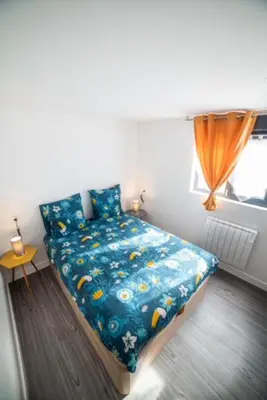 Un ou plusieurs lits dans un hébergement de l'établissement Appartement Sun GroupamaLyon Eurexpo