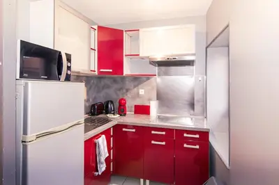 Cuisine ou kitchenette dans l'établissement Chic Stopover L'Olivier City Center & Flavors