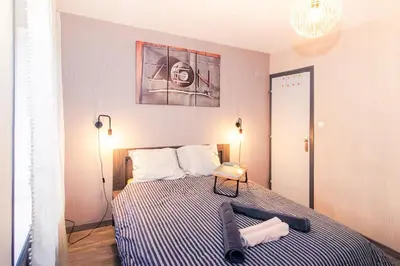 Un ou plusieurs lits dans un hébergement de l'établissement Chic Stopover L'Olivier City Center & Flavors