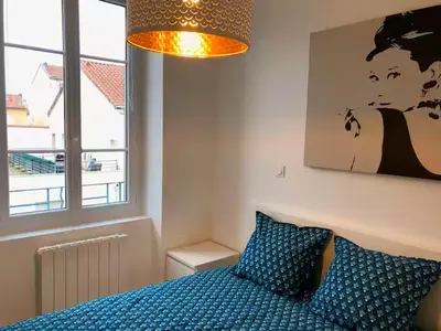Un ou plusieurs lits dans un hébergement de l'établissement Bel appartement