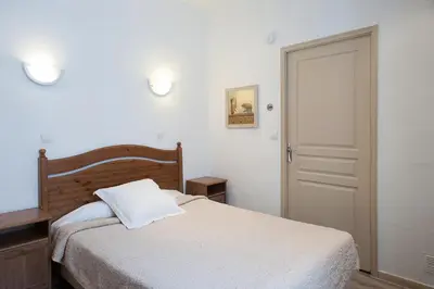 Un ou plusieurs lits dans un hébergement de l'établissement Hôtel des Facultés