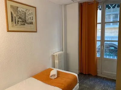 Un ou plusieurs lits dans un hébergement de l'établissement Hotel de Bretagne