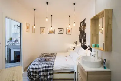 Un ou plusieurs lits dans un hébergement de l'établissement Suite Garibaldi Cosy et Design