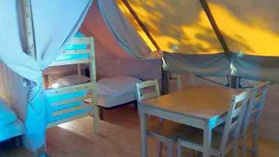 Un ou plusieurs lits dans un hébergement de l'établissement Camping le Nid du Parc