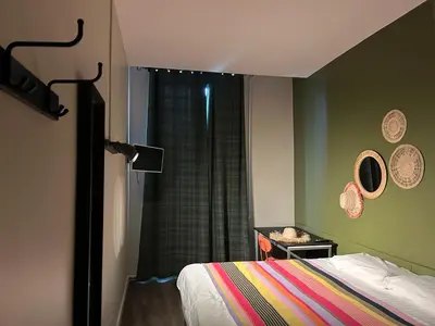 Un ou plusieurs lits dans un hébergement de l'établissement Hôtel de la Croix-Rousse