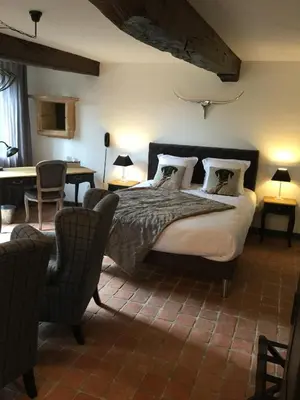 Un ou plusieurs lits dans un hébergement de l'établissement Contact Hôtels Le Savigny & Spa