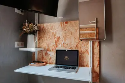 Télévision ou salle de divertissement dans l'établissement Hôtel Taggât