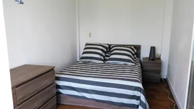 Un ou plusieurs lits dans un hébergement de l'établissement Bel appartement a vivre