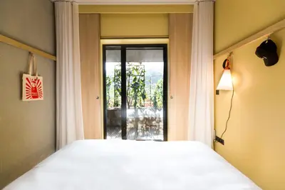 Un ou plusieurs lits dans un hébergement de l'établissement MOB HOTEL Lyon Confluence