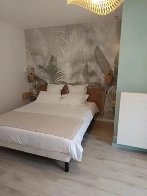 Un ou plusieurs lits dans un hébergement de l'établissement Villa'vi Lyon Est Chambres d'Hôtes
